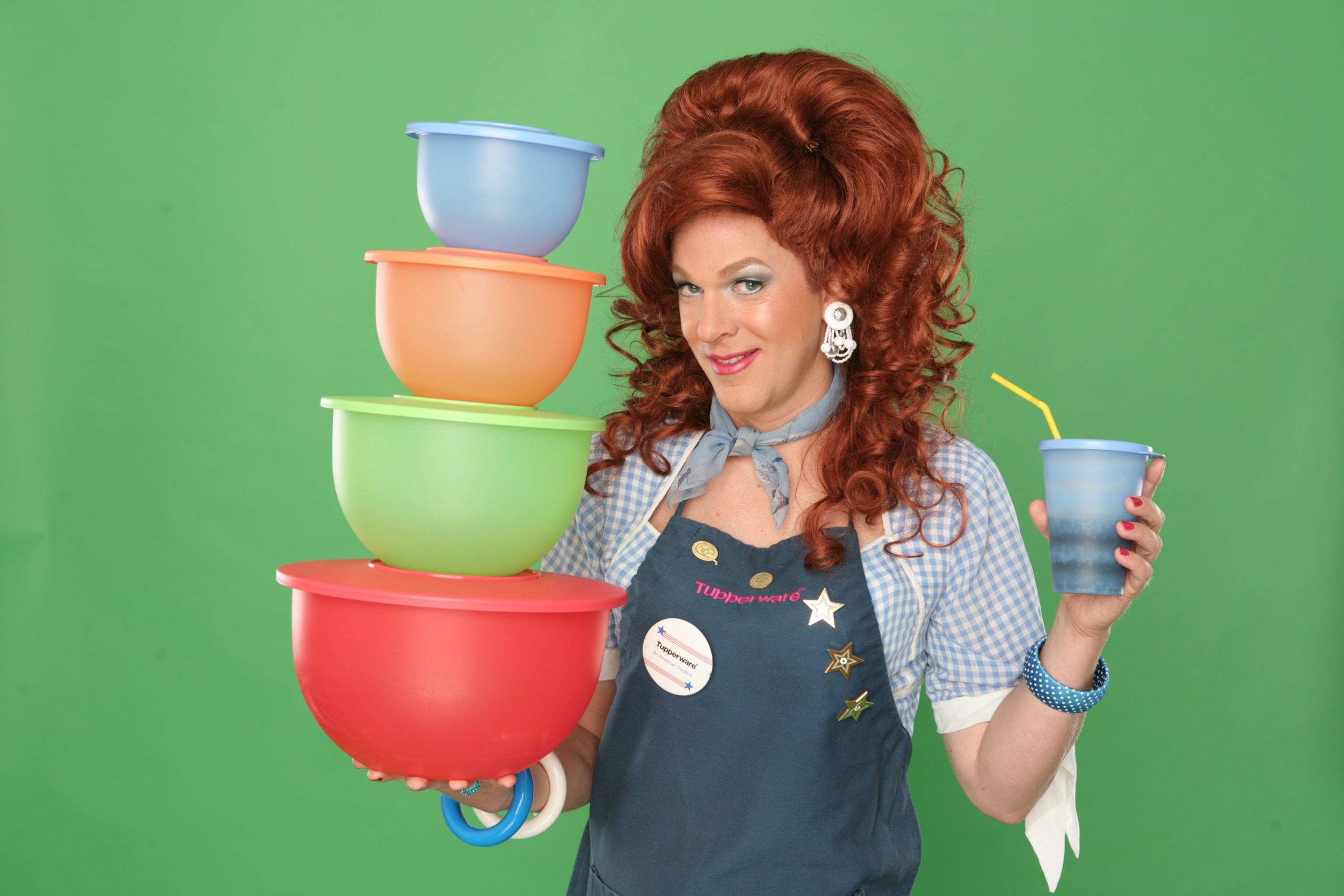 Dixie's Tupperware Party - Dixie holding Tupperware bowls